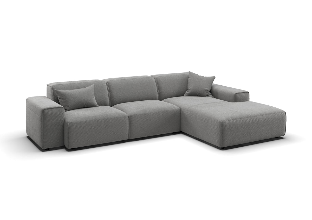 Lund Ecksofa mit Ottomane in Feincord Grau, Ottomane rechts – mit Dekokissen
